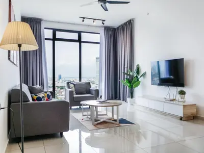 a living room with a couch and a tv at BEACON LeNa #Seaview#RoofTopPool#6pax#Georgetown in George Town