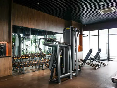 a gym with rows of treadmills and machines at BEACON LeNa #Seaview#RoofTopPool#6pax#Georgetown in George Town