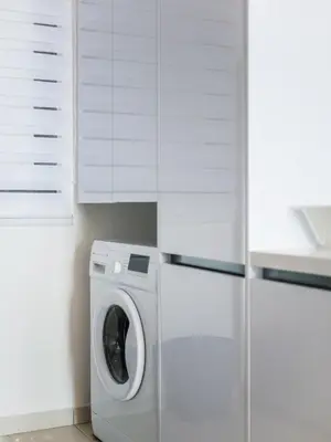 a kitchen with a washing machine and white cabinets at BEACON LeNa #Seaview#RoofTopPool#6pax#Georgetown in George Town