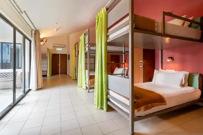 a room with two bunk beds and a hallway at Victoria Inn, Penang in George Town