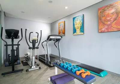 a fitness room with a gym with exercise equipment at Travelodge Georgetown, Penang in George Town