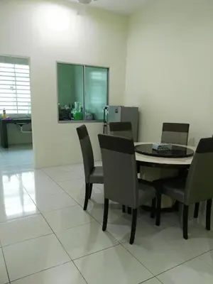 a dining room with a table and chairs at Fong's Ipoh SImpang Pulai Homestay in Ipoh
