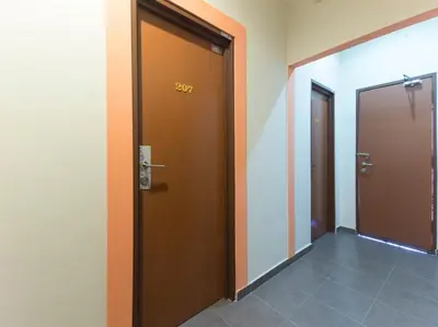 an office corridor with two doors with the number at Chemor Inn in Cemur