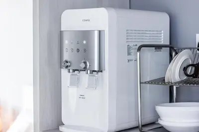 a white coffee machine sitting on a shelf at Beachboy Chalet By The Beach in Bukit Lada
