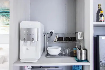 a kitchen with a mixer on a shelf at Beachboy Chalet By The Beach in Bukit Lada