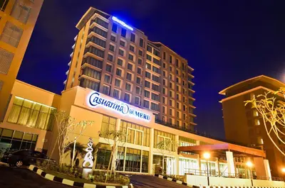 a large building with a sign on it at night at Casuarina@Meru in Ipoh