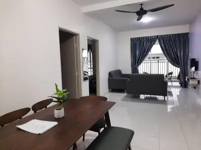 a dining room and living room with a table and chairs at BC Homestay @ Emerald Avenue Apartment, Brinchang in Brinchang