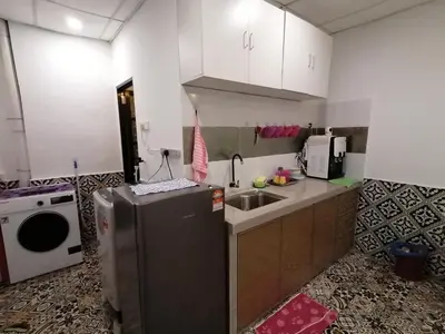 a small kitchen with a sink and a refrigerator at Fastbook Ferringhi SoHo unit 8pax in Batu Ferringhi