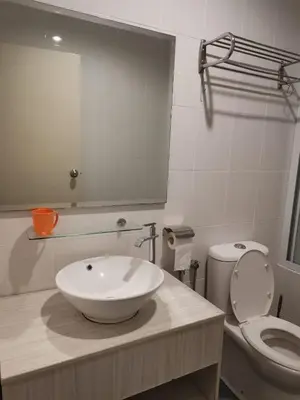 a bathroom with a sink and a toilet at Peaceful 1-bedroom unit at Marina Island by JoMy Homestay in Lumut