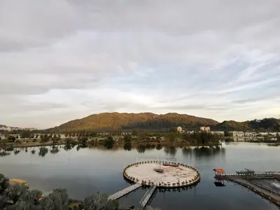 an island in the middle of a lake at Peaceful 1-bedroom unit at Marina Island by JoMy Homestay in Lumut