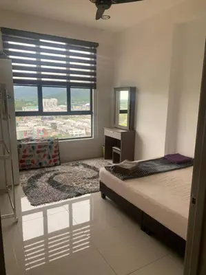a bedroom with a large bed and a window at Lizs Homestay in Ipoh
