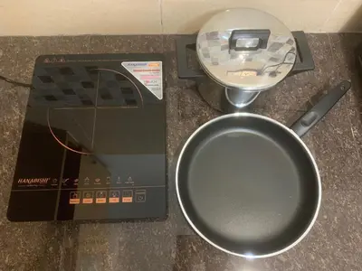 a food scale sitting on top of a counter with a pan at Queen Room Semi Attached Bathroom Bukit Mertajam Alma Impian in Bukit Mertajam