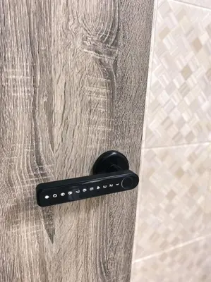 a black remote control on the floor of a shower at Queen Room Semi Attached Bathroom Bukit Mertajam Alma Impian in Bukit Mertajam