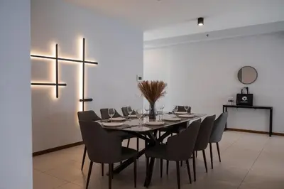 a dining room with a table and chairs at Large Family Seaview Suite 3 Rooms by The Only Bnb in Tanjong Tokong
