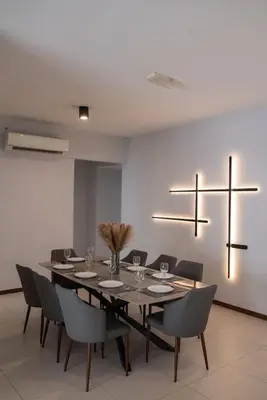 a dining room with a long table and chairs at Large Family Seaview Suite 3 Rooms by The Only Bnb in Tanjong Tokong