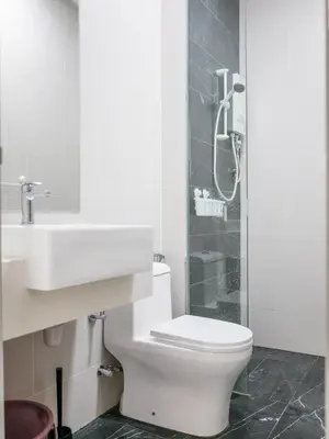 a bathroom with a toilet and a sink and a shower at Comfy Stay at Beacon#6pax#2carpark#SunsetView#Georgetown in George Town