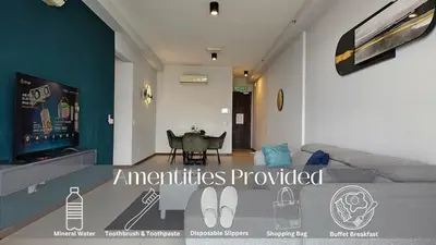 a living room with a couch and a table at Family Seaview Suite with 3 Rooms by The Only Bnb in Tanjong Tokong