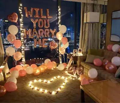 a living room with balloons and a sign that reads will you marry me at Deluxe Seaview Suite Twin Bed by The Only Bnb in Tanjong Tokong