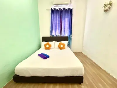 two teddy bears sitting on a bed in a room at Cozy 18 Entire 3 Bedroom @Alma Bukit Mertajam in Bukit Mertajam