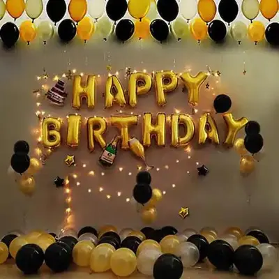 a happy birthday cake with black and yellow balloons at Deluxe Seaview Suite Twin Bed by The Only Bnb in Tanjong Tokong