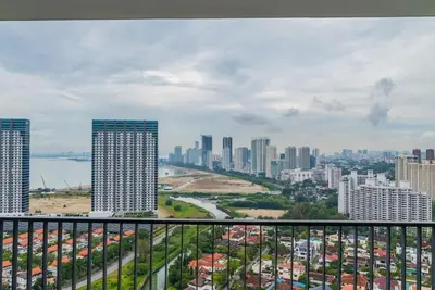 a view of a city skyline with tall buildings at Deluxe Seaview Suite Twin Bed by The Only Bnb in Tanjong Tokong
