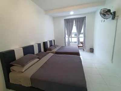 a bedroom with two beds and a window at Dream 3 @ Emerald avenue in Brinchang