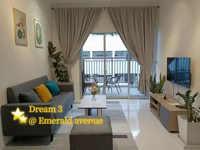 a living room with a couch and a table at Dream 3 @ Emerald avenue in Brinchang