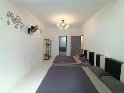 a bedroom with three beds in a room with at Dream 3 @ Emerald avenue in Brinchang