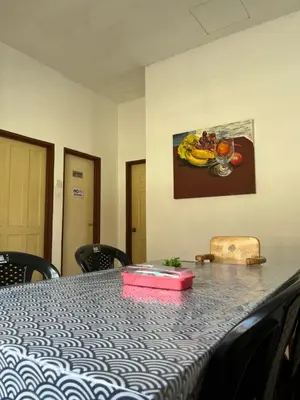 a table with a pink box on top of it at Solehah Homestay in Seri Iskandar