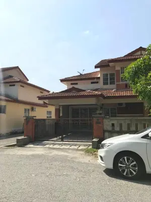 a white car parked in front of a house at Solehah Homestay in Seri Iskandar