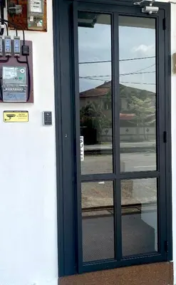 a door to a building with a window at comfy 3-bedrooms with family karaoke Max-10pax in Ipoh