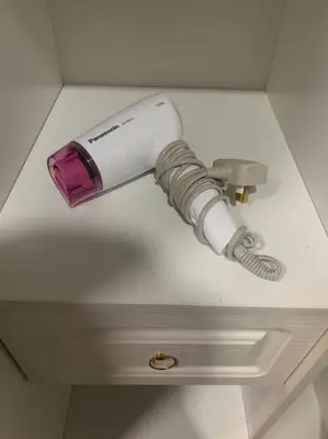 a white and purple object on a ceiling at Private Bathroom in King Room Bukit Mertajam Alma Impian in Bukit Mertajam