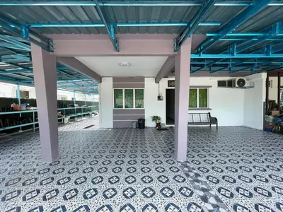 an empty room with blue ceilings and a bench at NORISH HOMESTAY in Bayan Lepas