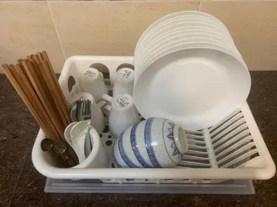 a container filled with dishes and utensils at Kota Permai Mini Rest Room 99 Full Equipped in Bukit Mertajam