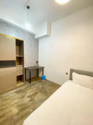 a bedroom with a bed and a desk at Kota Permai Mini Rest Room 99 Full Equipped in Bukit Mertajam