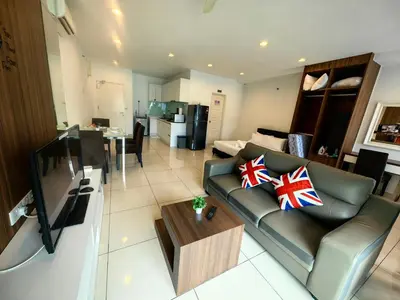 a living room with a couch and a table at LS Mansion One in George Town
