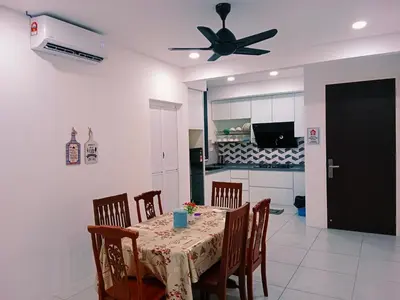 a dining room with a table and a ceiling fan at Preferred30 3R2B 7pax Meritus Perai in Perai