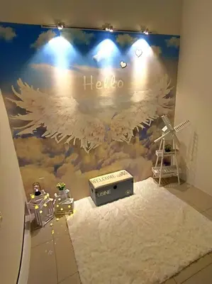 a room with a wall with an eagle painted on it at De cozy 5.0 Double storey (10-16 pax ++) in Ipoh