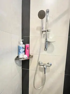 a shower with a shower head in a bathroom at Nova Mountain n Sunrise view Hilltop Hotel Apartment in Cameron Highlands in Cameron Highlands
