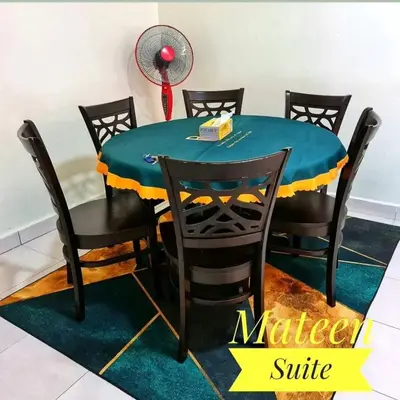 a table and chairs with a blue and yellow table at M Suite in Tanah Rata