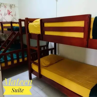 a bedroom with three bunk beds in a room at M Suite in Tanah Rata
