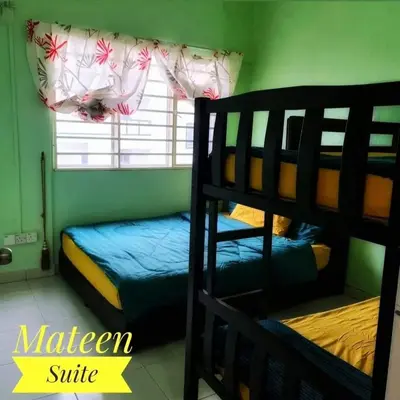 a bedroom with two bunk beds and a window at M Suite in Tanah Rata