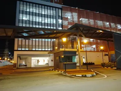 a large building at night with lights on at Comfortable18 3R2B 7pax Meritus Perai in Perai