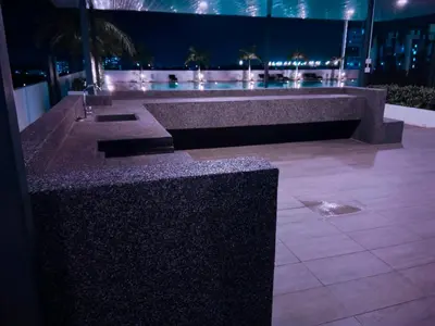 a stone bench in a building at night at Comfortable18 3R2B 7pax Meritus Perai in Perai