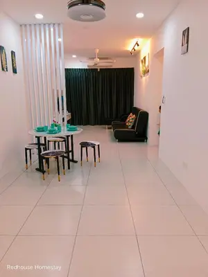 a living room with a couch and a table and chairs at Comfortable18 3R2B 7pax Meritus Perai in Perai