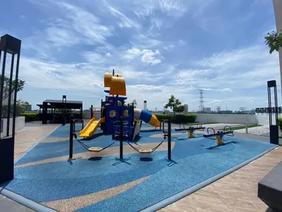 a playground with a slide in a park at Comfortable18 3R2B 7pax Meritus Perai in Perai