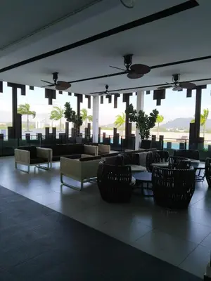 a lobby with chairs and tables in a building at Comfortable18 3R2B 7pax Meritus Perai in Perai