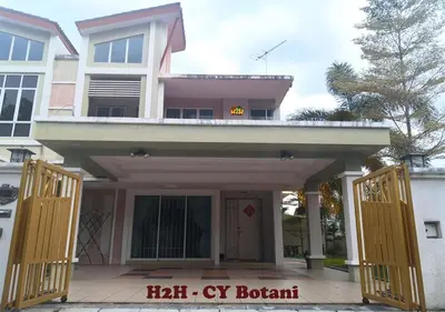 a house with an open door with a clock on it at H2H - CY Botani Vacation House (15pax) in Ipoh