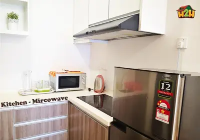 a kitchen with a refrigerator and a microwave at H2H - CY15 @ Majestic Ipoh in Ipoh