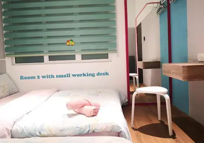 a small bedroom with a bed with a pink doll on it at H2H - CY7 @ Majestic Ipoh in Ipoh